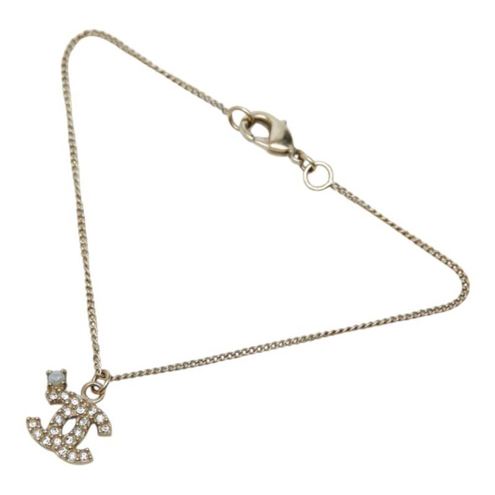 CHANEL Gold Pearl Logo Charm Bracelet - Picture 1 of 7